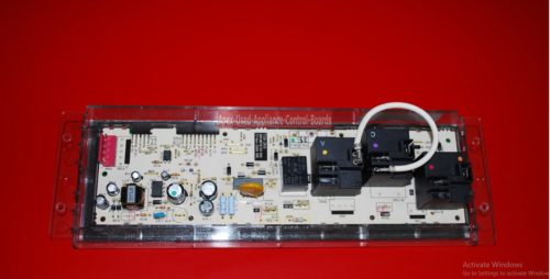 Part # WB27T11488, 164D8450G035 GE Oven Electronic Control Board And Clock (used, overlay dark gray)
